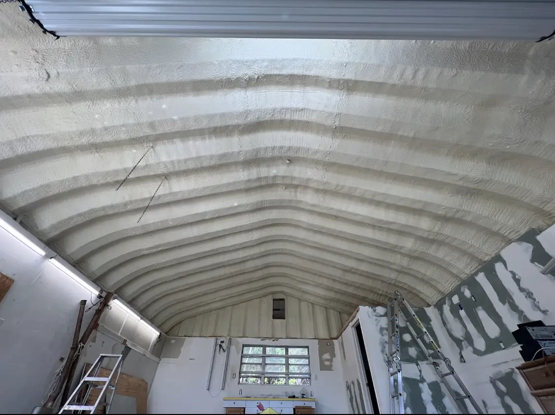 Spray polyurethane foam applied to the underside of a metal roof deck in Wesley Hills